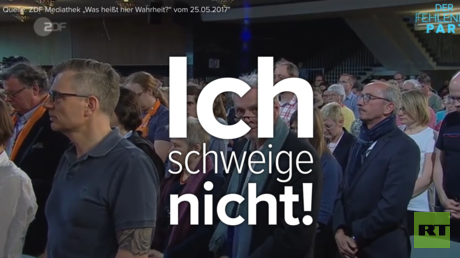 "Ich schweige nicht" - Unbekannter stört Schweigeminute für Flüchtlinge am Kirchentag