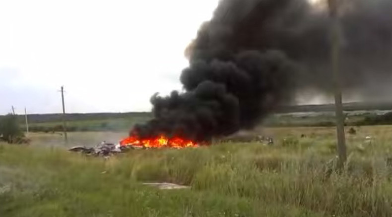 ‘Bodies all over’: New MH17 crash site footage minutes after Boeing downing (VIDEO)