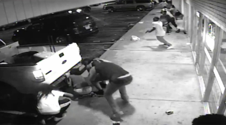 New surveillance footage shows Ferguson protester shot by cops had pistol – police