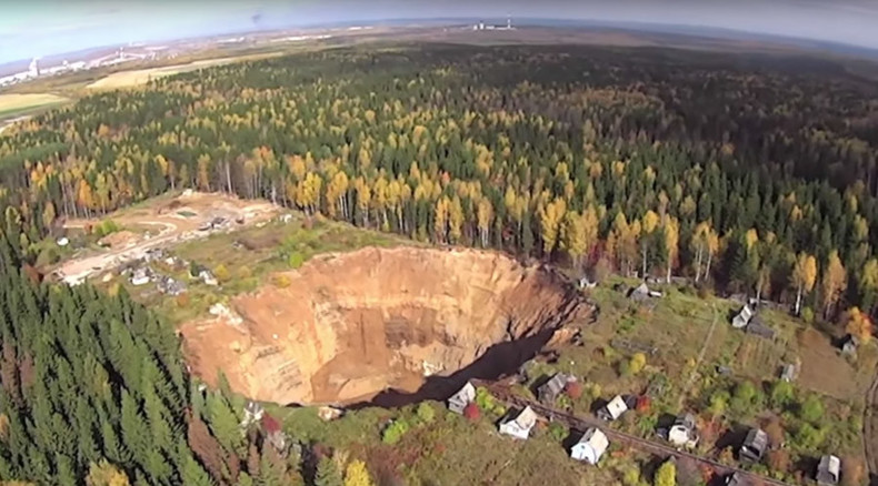 Drone gets terrifying glimpse of growing sinkhole in northeast Russia (VIDEO)