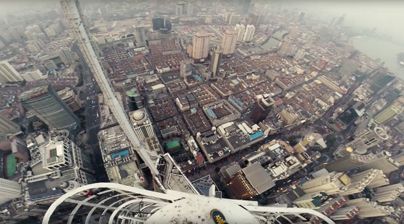 Two Shanghai Spires: Roofers stand on needle point hundreds of meters above ground (VIDEO)