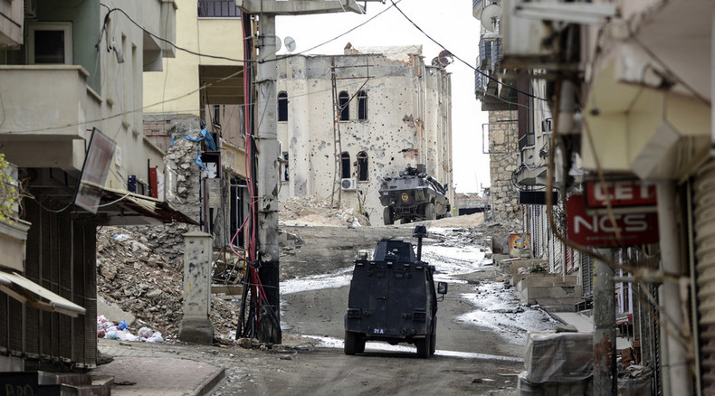 ‘Erasing from map’? Scenes of destruction as Turkish military besiege Kurdish town of Silvan (VIDEO)