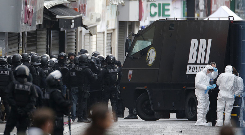 Paris shootout: 2 dead, incl. female suicide bomber, 7 arrested as police, army hunt suspects 