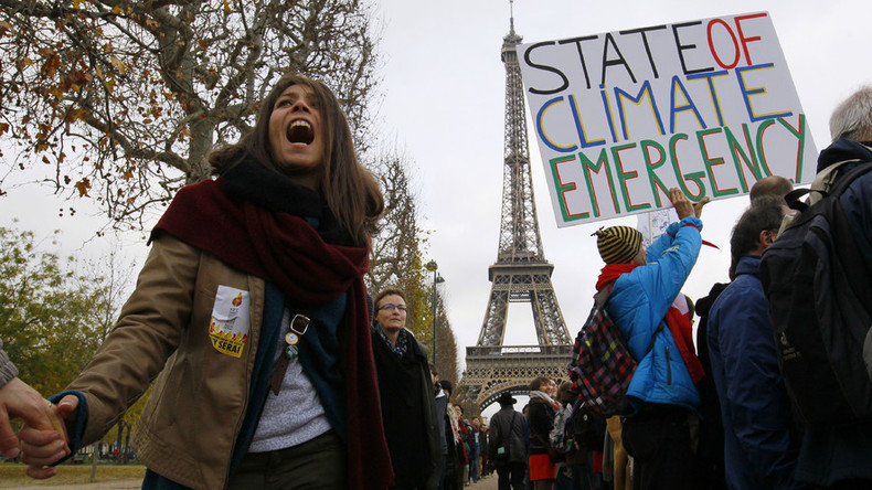 ‘Historic accord’ on climate adopted, activists in Paris denounce deal as ‘weak’