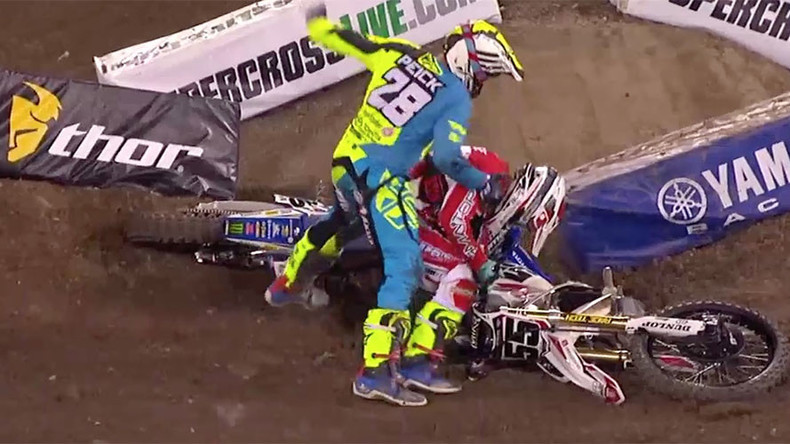 Irate motocross rider punches fellow competitor after crash (VIDEO)