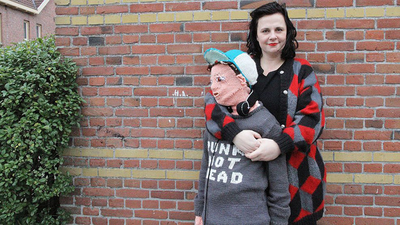 Wooly Weirdness: Mother knits life-size onesie of her own sons (PHOTOS)