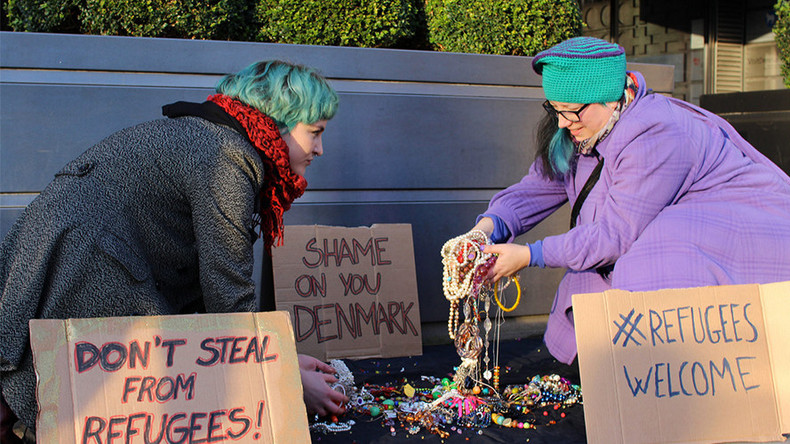 LGBT activists dump jewelry outside Danish embassy to protest seizing of refugees’ valuables