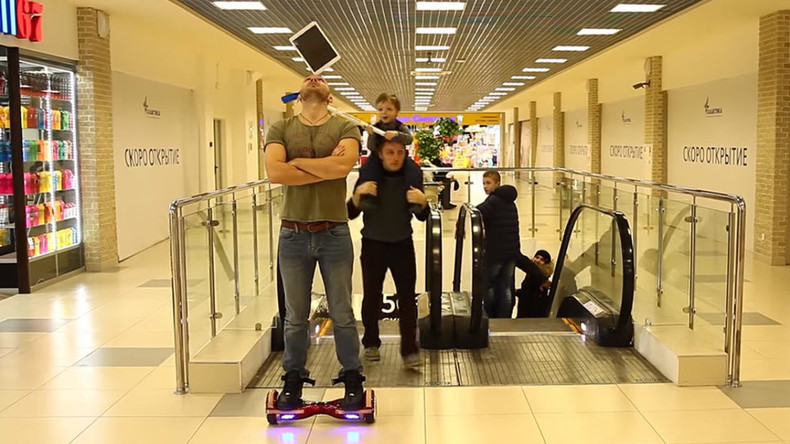 Boy takes out iPad off hoverboarding circus performer’s head (VIDEO)
