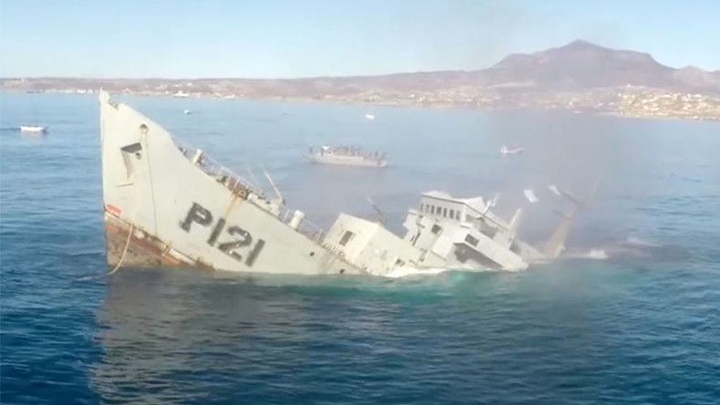 That sinking feeling: Explosive on-board footage shows battleship drop beneath the waves (VIDEO)