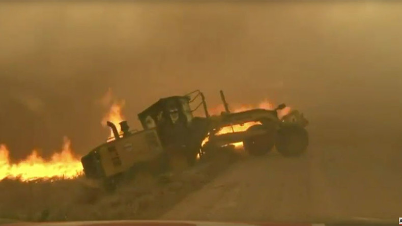 News team saves man from raging inferno while chasing Oklahoma wildfires (VIDEO)