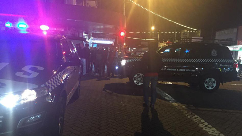 'Deliberate attack': Man sets himself alight, drives car into Sydney police station parking lot