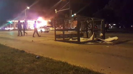 Protesters riot, burn cars & properties after fatal officer-involved shooting in Milwaukee, WI