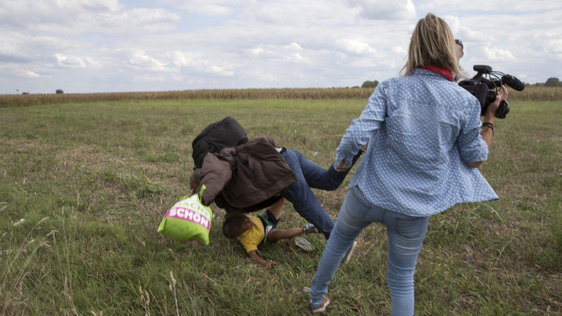 Camerawoman who kicked fleeing refugees charged in Hungary