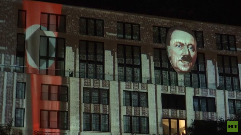 Controversial Hitler installation illuminates building in Berlin (VIDEO)