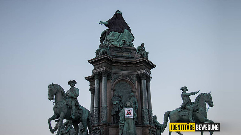Austrian far-right group covers queen’s statue with veil in anti-Islam protest