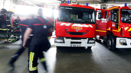 1 dead, 14 injured in blaze at Paris migrant center