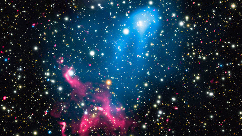 Colliding galaxy clusters meet supermassive black hole to create cosmic particle accelerator