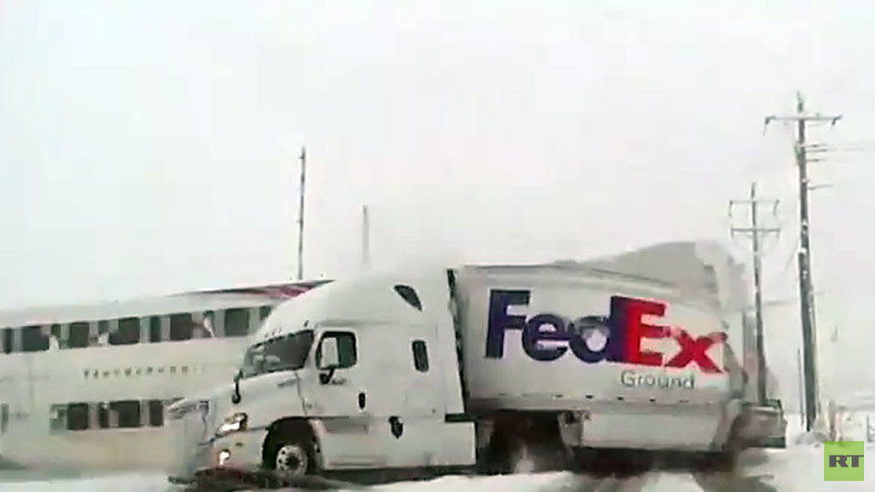 Passenger train smashes through FedEx truck at railway crossing (VIDEO)
