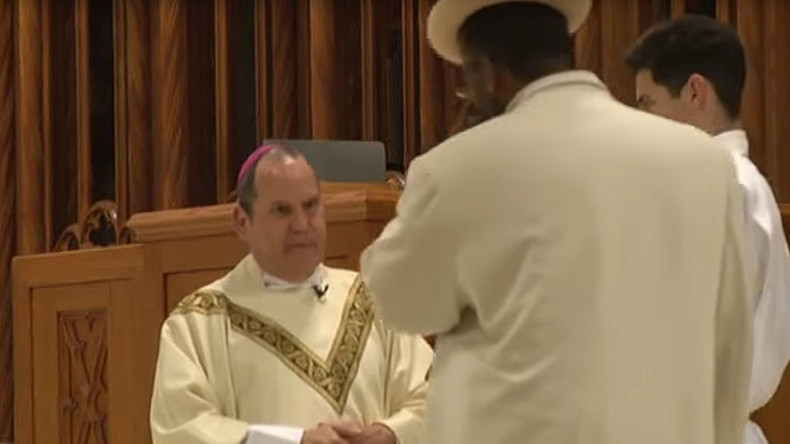 Forgive us our sins: Catholic bishop punched in face during mass (VIDEO)
