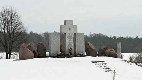 Monument to Polish WWII massacre victims desecrated with fascist symbols in Ukraine (VIDEO)