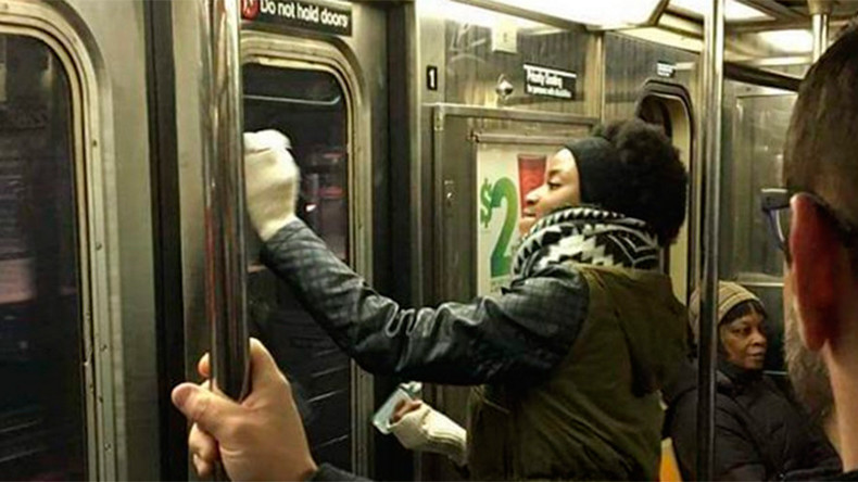 Swastika takedown: New York subway riders tackle Nazi symbols on train (PHOTOS)