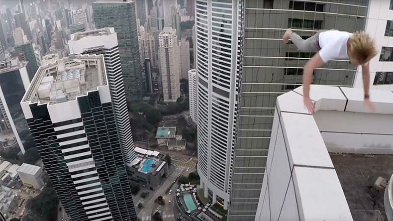 Russian rooftopper skateboards & somersaults on ledge of Hong Kong skyscraper (VIDEO)