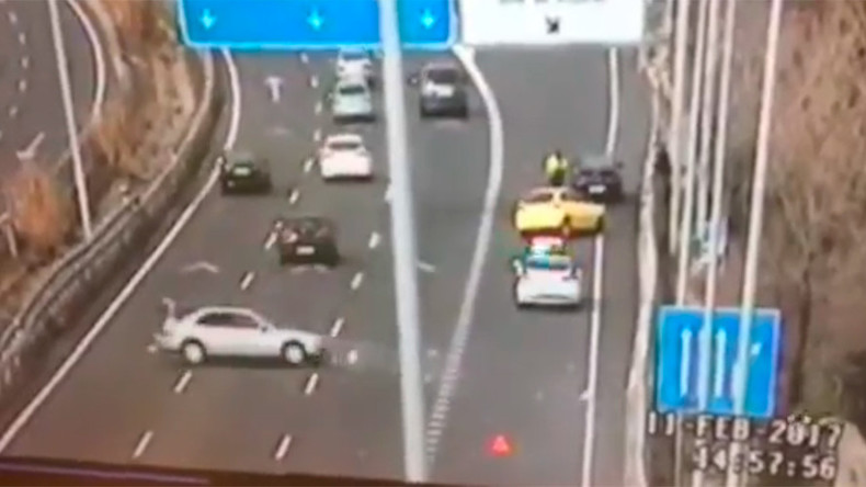 Cop cheats death in last-minute leap as car hurtles toward him (VIDEO)