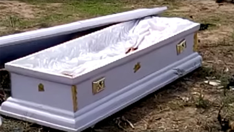 Grave situation: Corpse seized during funeral after family fail to pay fees (GRAPHIC VIDEOS)