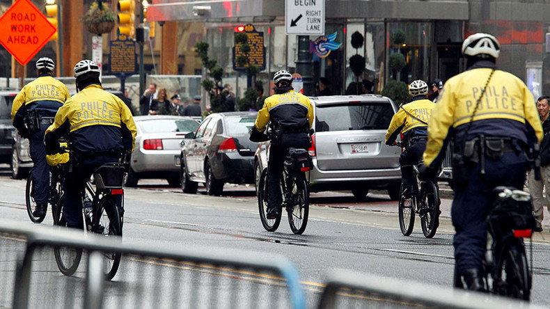 Philadelphia Police investigating officer for swinging bike at protester