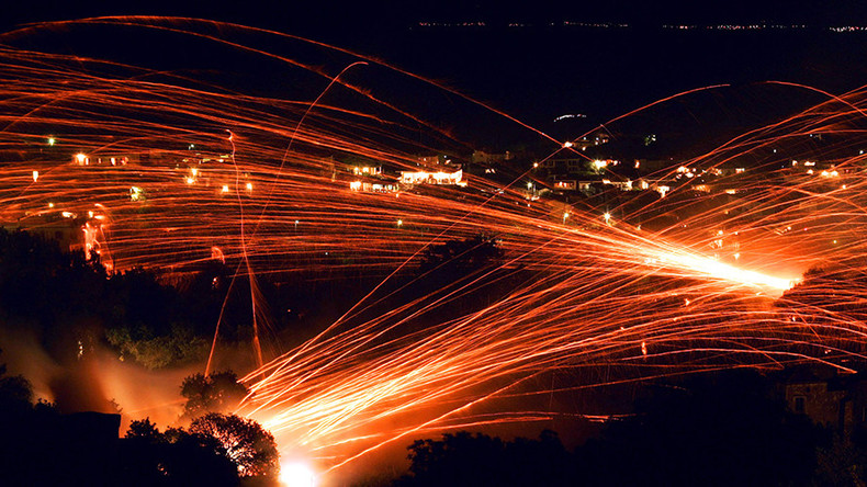 ‘Rocket War’ returns to sleepy Greek island as thousands of fireworks light up night sky (VIDEO)