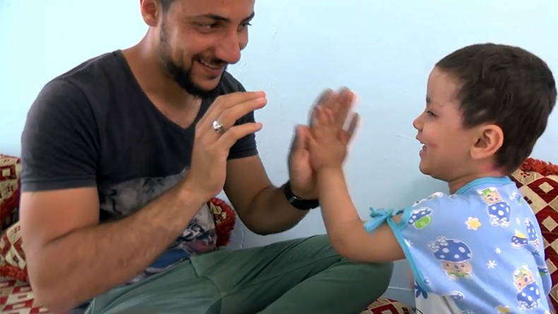 4-yo survivor of US-led coalition airstrike still has shrapnel in her legs & face (VIDEO)