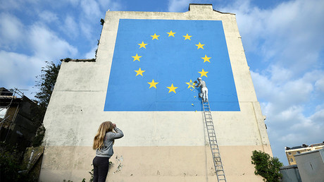 New Brexit-themed Banksy shows workman chipping away at EU flag