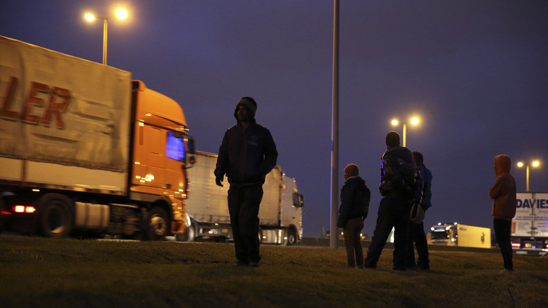 Van driver dies as he crashes into tail-back after migrants set up roadblock near Calais