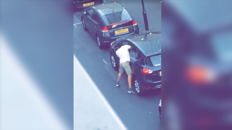 Masked attacker lunges through car window and violently stabs driver (VIDEO)