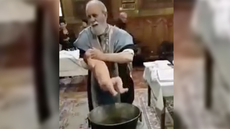 Berserk baptism: Priest loses it over screaming baby in Romania (VIDEO)