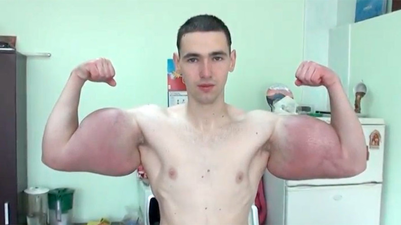 Russian showcases jaw-dropping foot wide biceps (VIDEO)