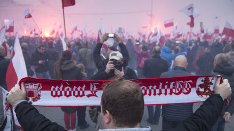 ‘White Europe of brotherly nations’ – Tommy Robinson represents UK at huge far-right Polish demo  