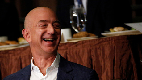 Back to earth, Bezos! Amazon chief under fire for space travel plans as workers struggle