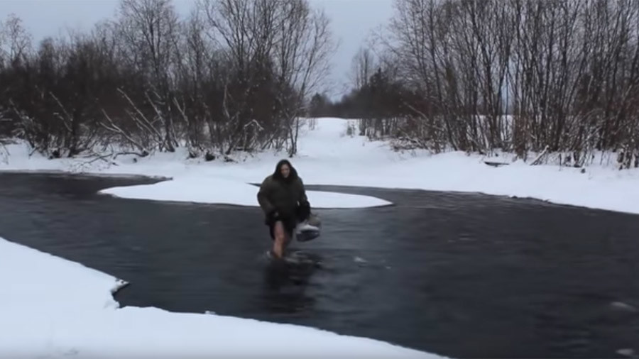 Russian babushka wades barefoot through river in bitter cold (VIDEO)