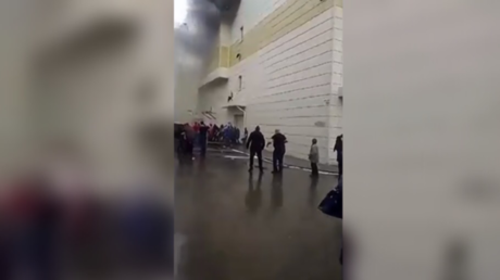 Dramatic VIDEO shows man jumping out of burning shopping mall in Russia