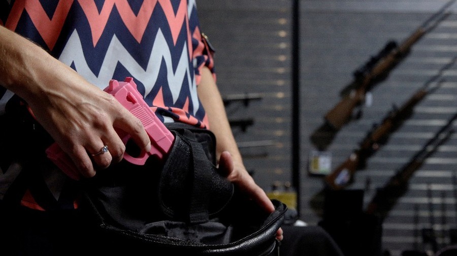 Viral ‘grad with rifle’ image continues to cause a stir as Jim Carrey joins the debate