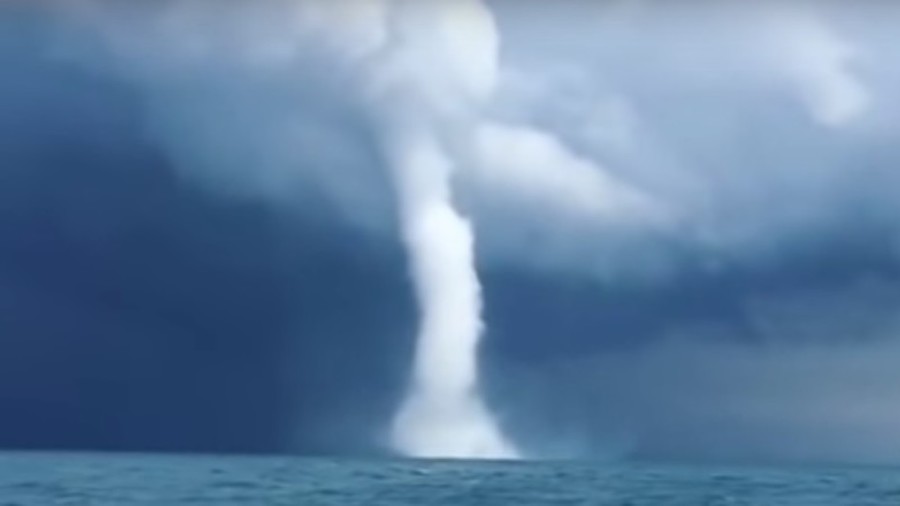 ‘It looks like it will catch us’: Russian fishermen film stunning waterspout (and it did catch them)