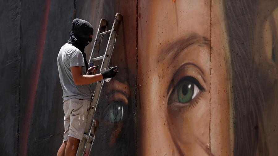 Italian artist who painted mural of Palestinian heroine Ahed Tamimi arrested in Israel