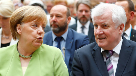 Merkel reaches deal with sister party head over immigration after days of standoff