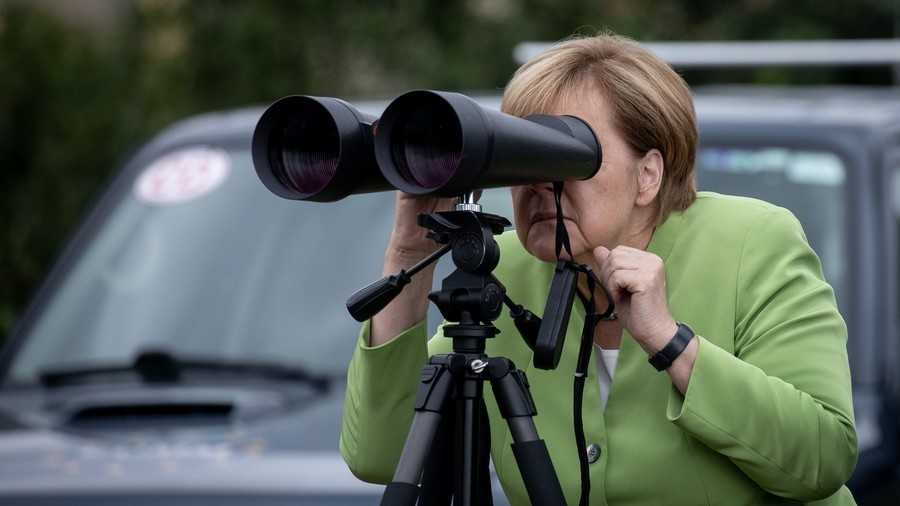 What did Angela see? Russians ridicule Merkel for spying on ‘Putin’s base’ with large binoculars