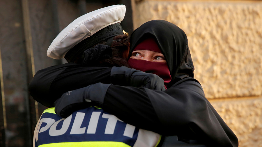 Denmark investigating policewoman who hugged niqab-wearing protester