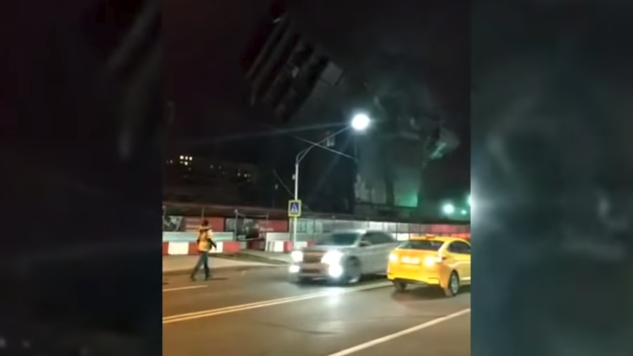 Demolition gone wrong? Debris flung at busy road as multi-story building collapses (VIDEO)