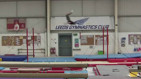 Flippin' amazing: UK gymnast sets incredible backflip world record on horizontal bars (VIDEO)
