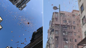 ‘Superhero of justice’ or PR stunt? Cash rained down on poor Hong Kong neighborhood (VIDEOS)