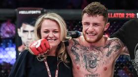 'Don't f***ing touch her!' MMA star rages as official tries to break up celebrations with mother